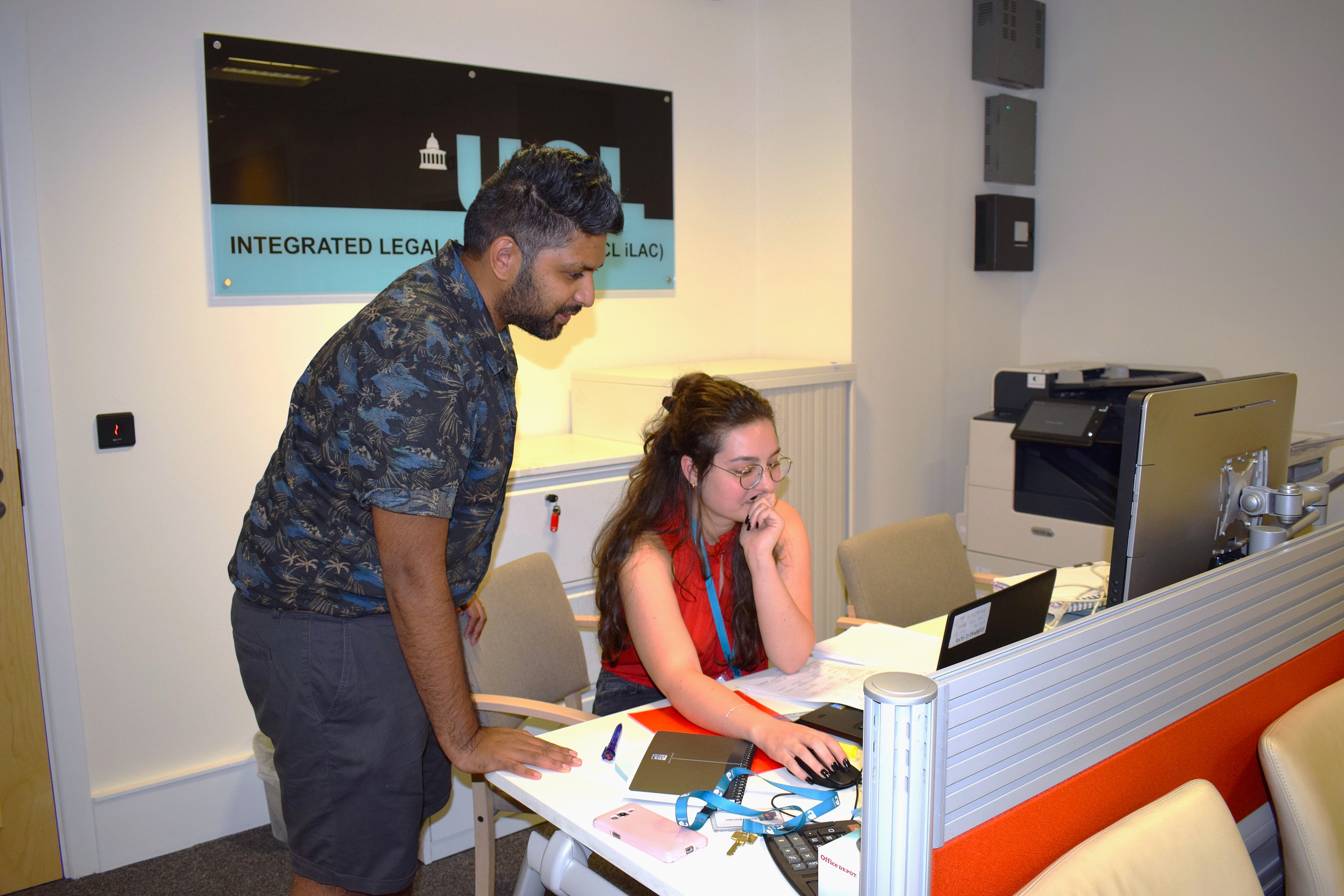 Student and iLAC solicitor looking at a computer