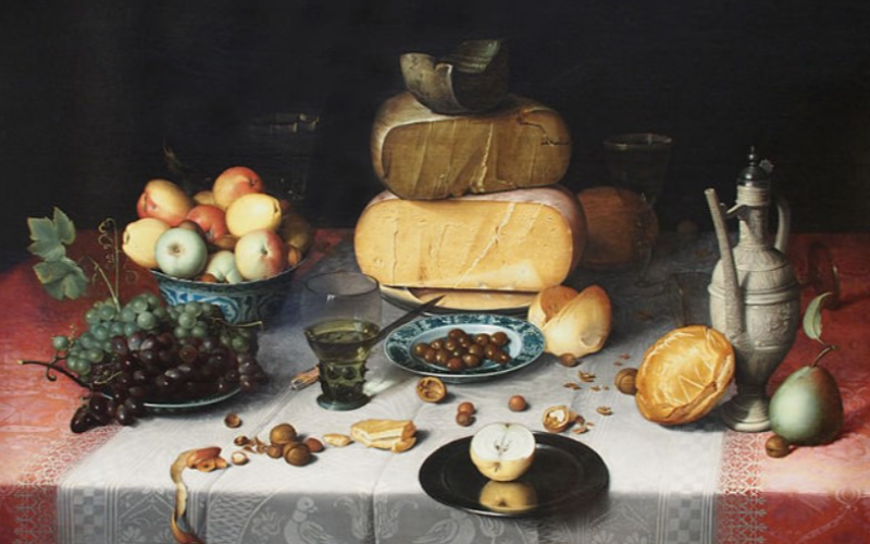 still life of cheese and fruit on table