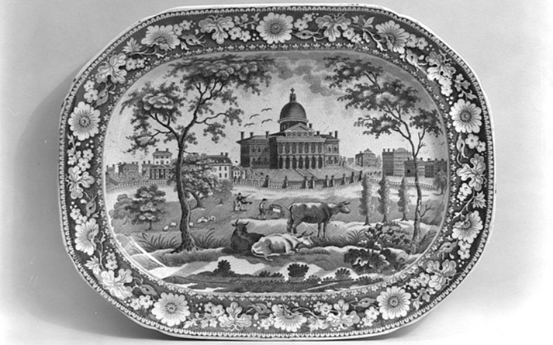 Black and white image of platter by John Rogers and Son. Scene depicts domed building, fields with cows and flowers.