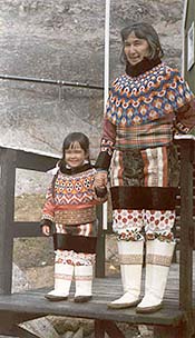 woman and a little girl dressed in Greenlandic national costume