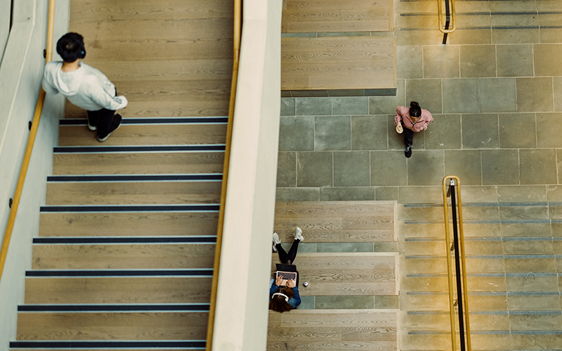 Students walking down staircases