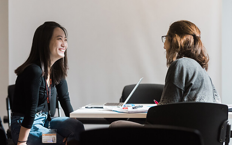 A student speaking to a supervisor