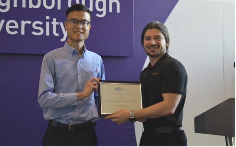Alex Fung receiving an award for first place in the PhD Poster Competition