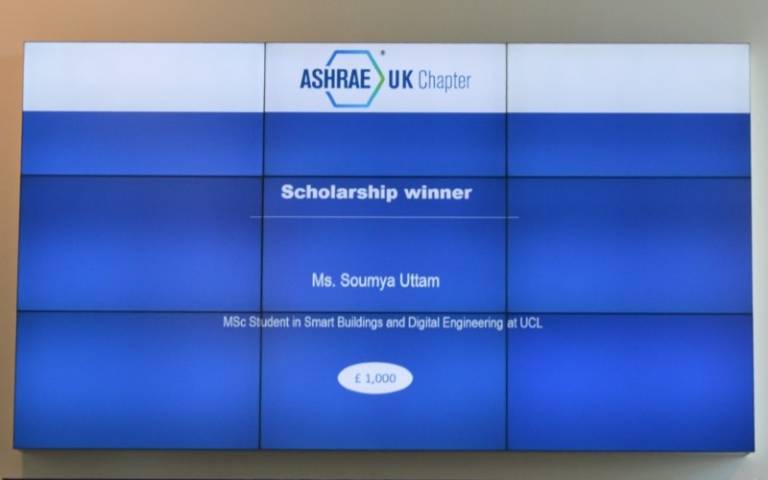 A blue projector screen which indicates that Soumya Uttam was awarded the winner of the ASHRAE UK Student Scholarship