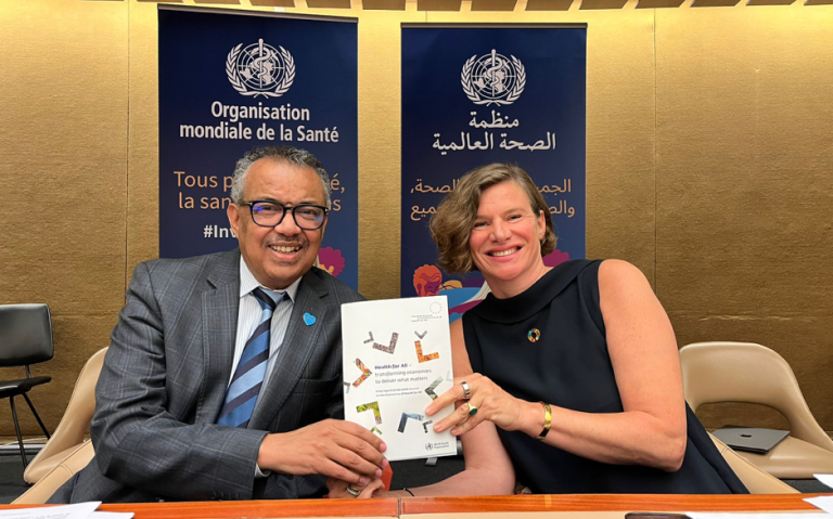 Prof Mazzucato and Director General of WHO Dr Tedros Adhanom Ghebreyesus hold up the final report of the WHO Council on the Economics of Health for All.