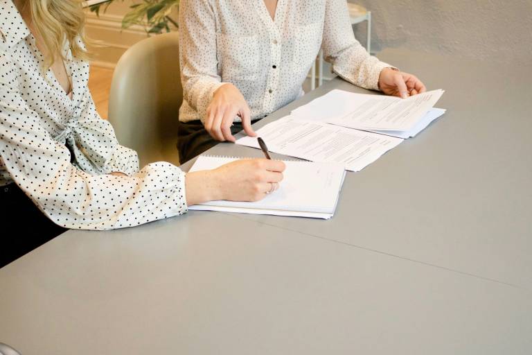 Two people looking at documents