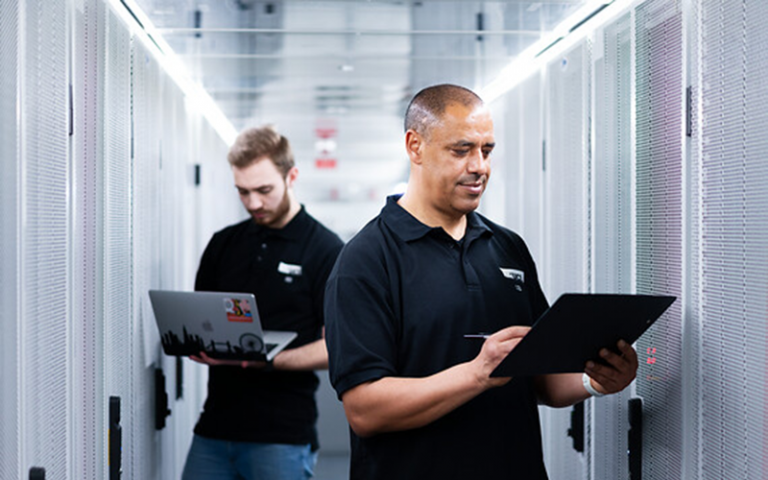 2 men in a computer server room