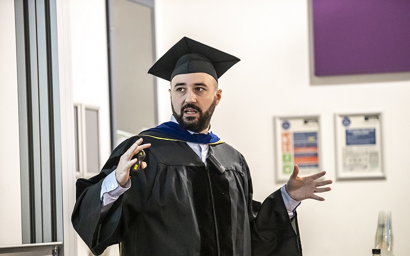 Emiliano in his academic attire giving inaugural lecture 