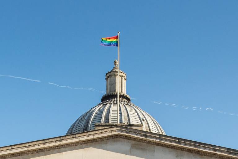 Rainbow flag flying above the portico