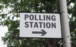 A polling station sign.