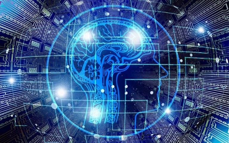 A styalised cross section of a human head in blue outline is set on top of a background of computer circuits and chips