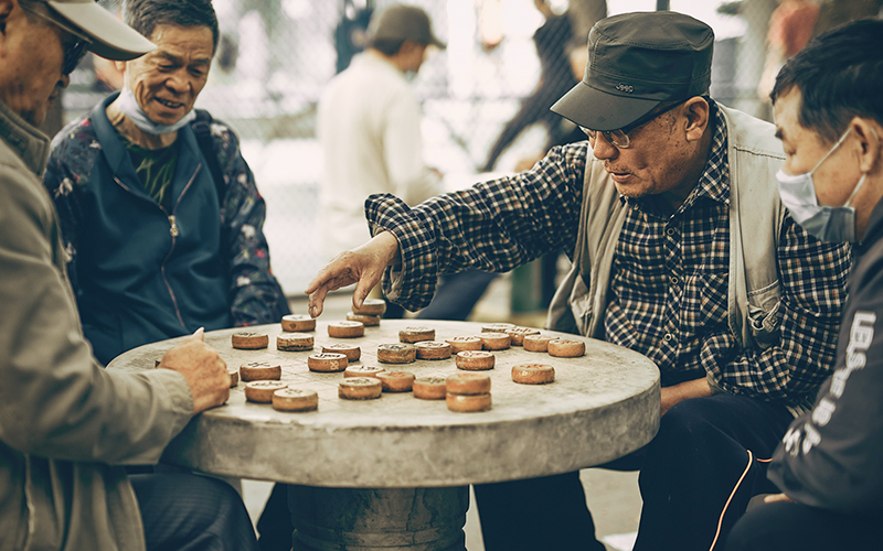 an image of some elderly gentlemen playing a game