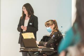 Opera singer next to Hannah Conway on a keyboard