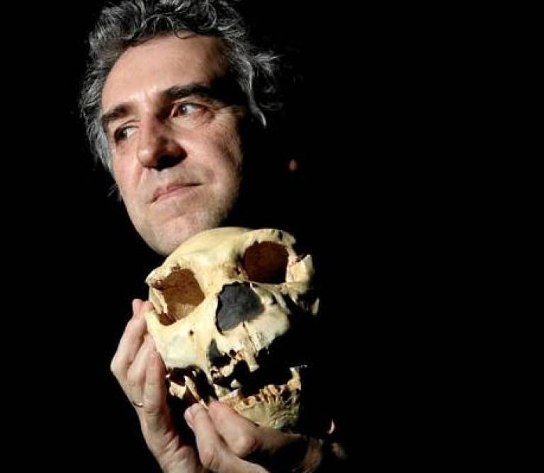 Juan Luis Arsuaga holding Cranium 5 attributed to Homo neanderthalensis