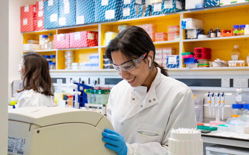 A scientist working in a lab promotional image 