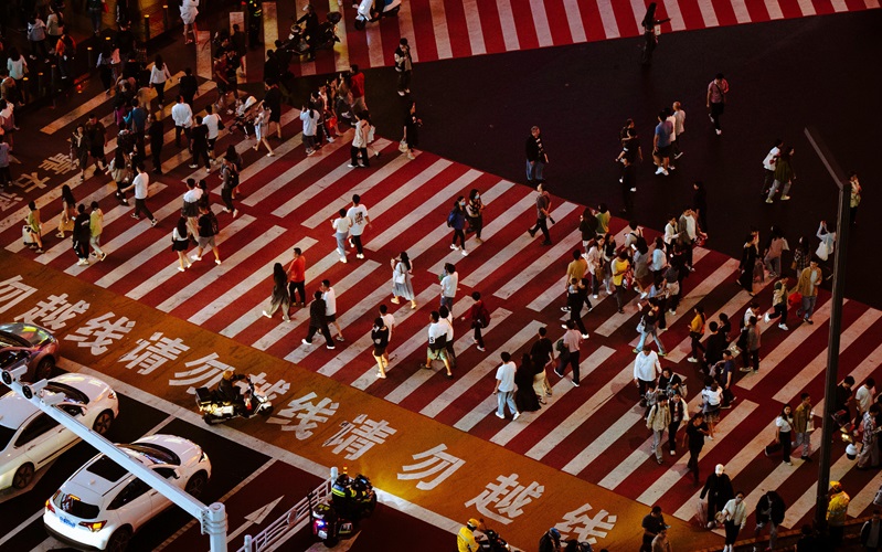 people crossing road in China