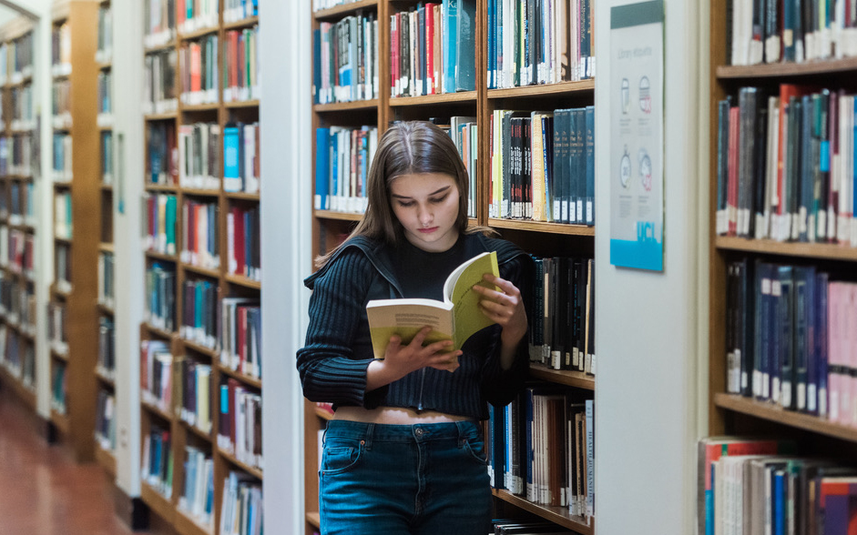 Student reading book in the library