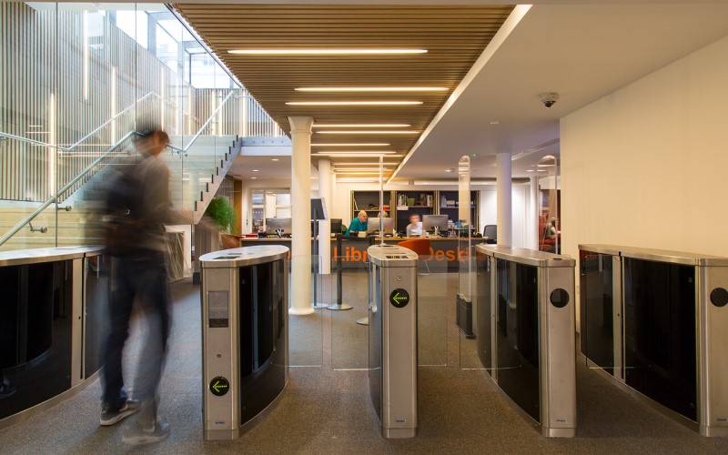 Library user approaching the Cruciform Hub entry gates