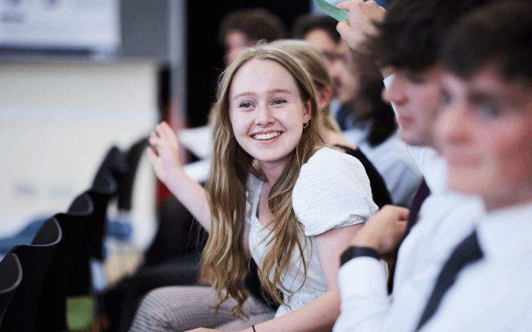 Smiling student at a conference