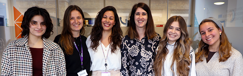 A picture of six women standing together smiling for the camera, the image contains Dr Catarina Veiga and her research group