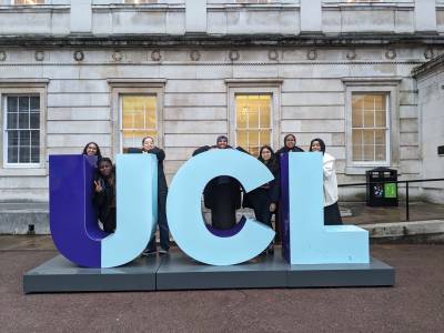 Visiting students with the UCL model sign in the Quad