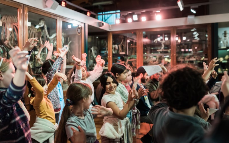 Children at the Work of Many Hands performance in the UCL Grant Museum