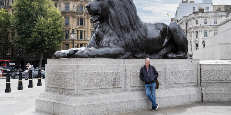 A man standing in Leicester Square