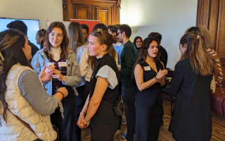 Students chat to each other at a drinks reception