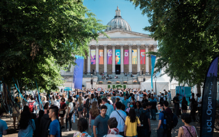The UCL main building and quad is busy with lots of different types of young person, flags and brightly coloured banners