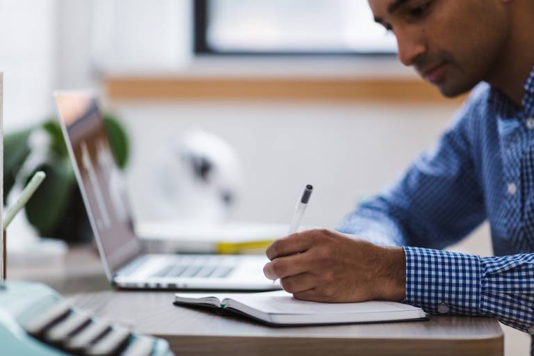 A man studying on a laptop