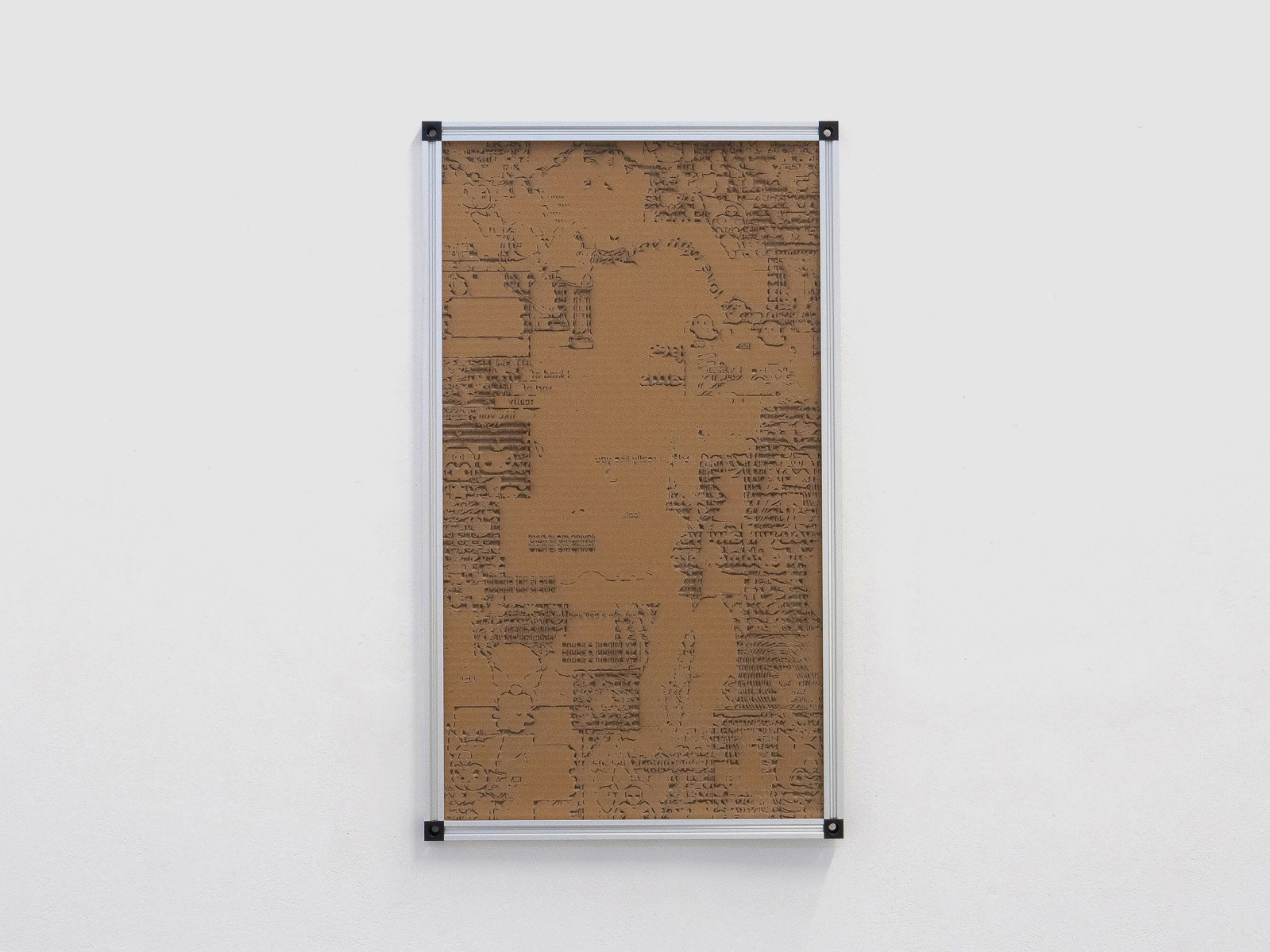 A piece of engraved cardboard that displays lots of small engravings. The engravings depict the internet noise from online goth subculture groups, including cartoon ghosts, chains, Kuromi, reversed words, hearts. The engravings aren't entirely legible. The work is in an aluminium v-slot frame.
