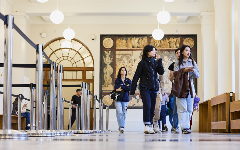 Image shows students walking in the corridor 