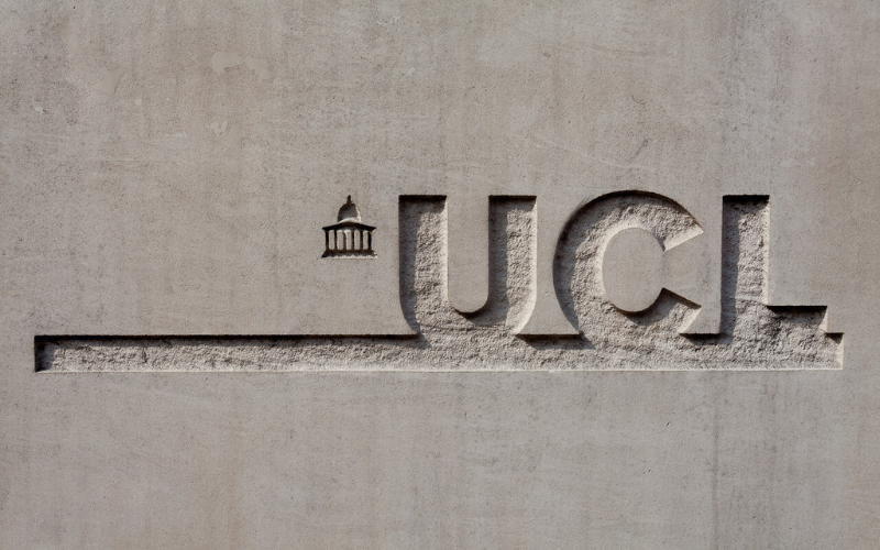 UCL Logo carved on wall outside Chandler House.