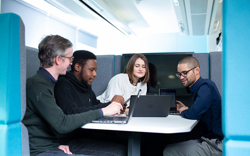 Photo of staff working in a booth