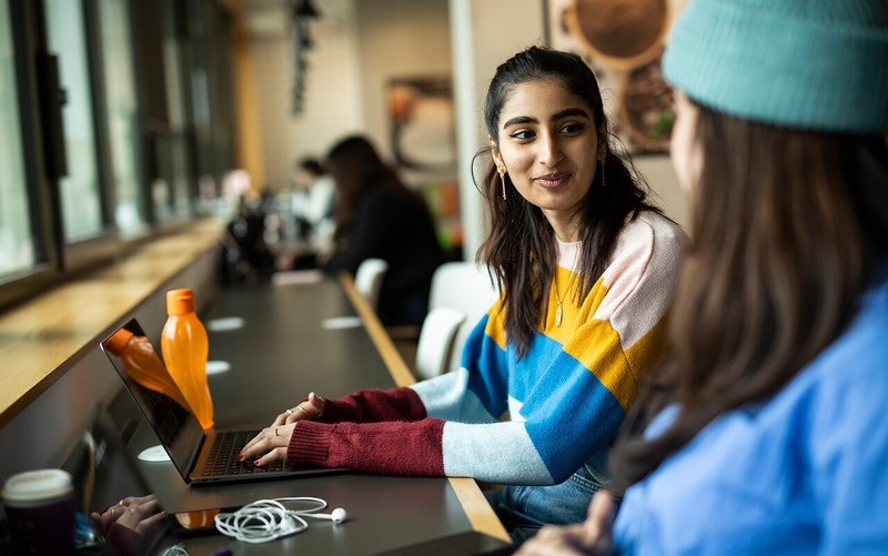 student sitting at laptop