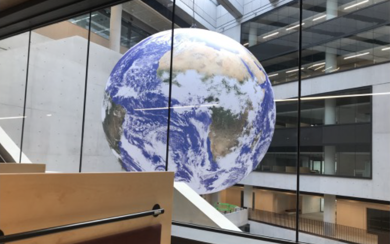 giant blow up globe handing from marshgate atrium cieling