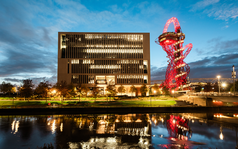 Marshgate building at night lit up