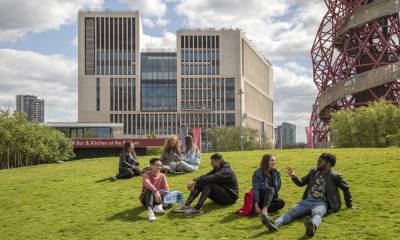 UCL students relaxing on lawn outside One Pool Street