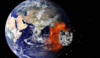 Globe of Earth as seen from space, but with fire and family crying on east side